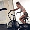 fit-young-woman-using-exercise-bike-at-the-gym-PCGRTB7-min.jpg